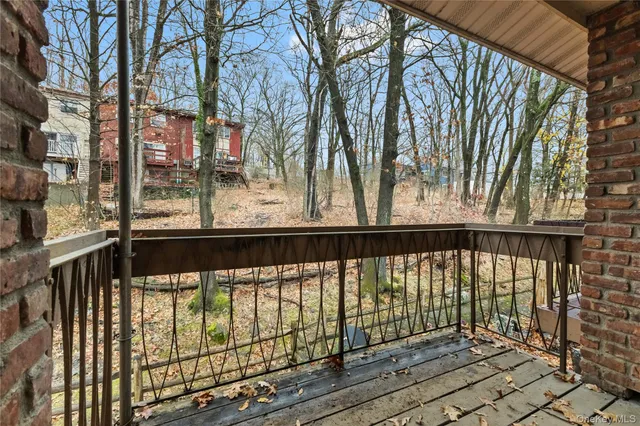 a view of a balcony with trees
