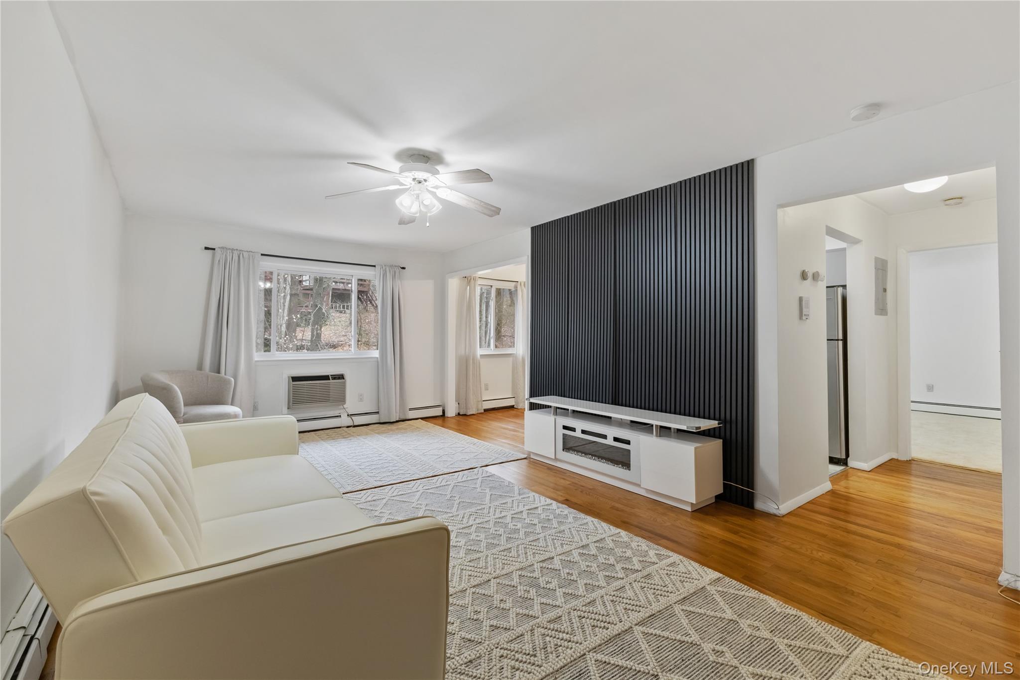 8 North James Street, Unit G Peekskill, NY 10566 - Photo 2 of 25 a living room with furniture and a flat screen tv