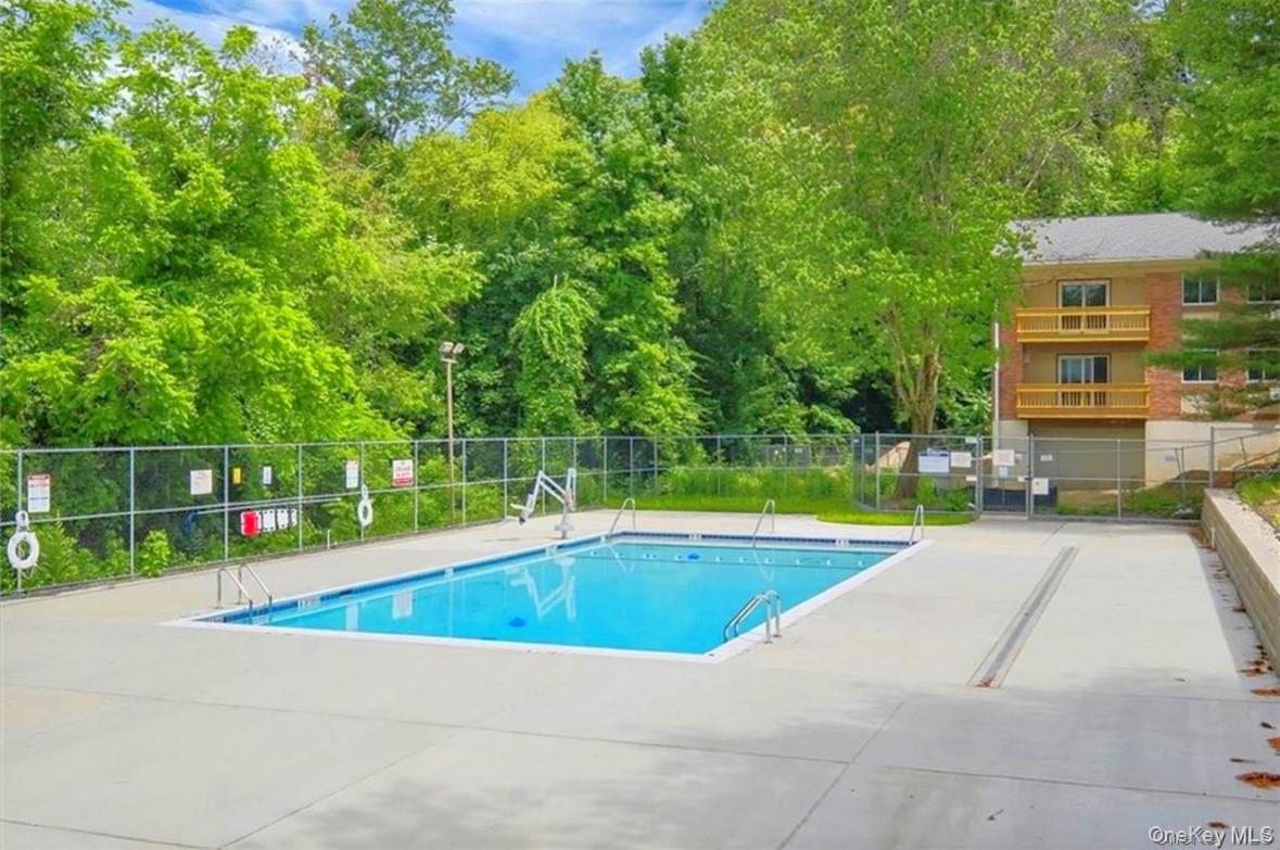 8 North James Street, Unit G Peekskill, NY 10566 - Photo 23 of 25 a view of pool with a bench and trees