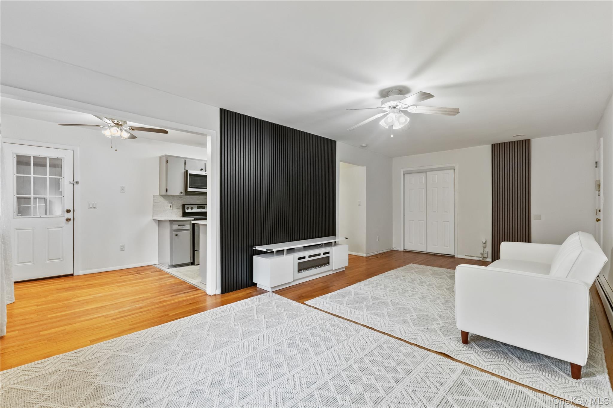 8 North James Street, Unit G Peekskill, NY 10566 - Photo 6 of 25 a bedroom with a bed and a flat screen tv