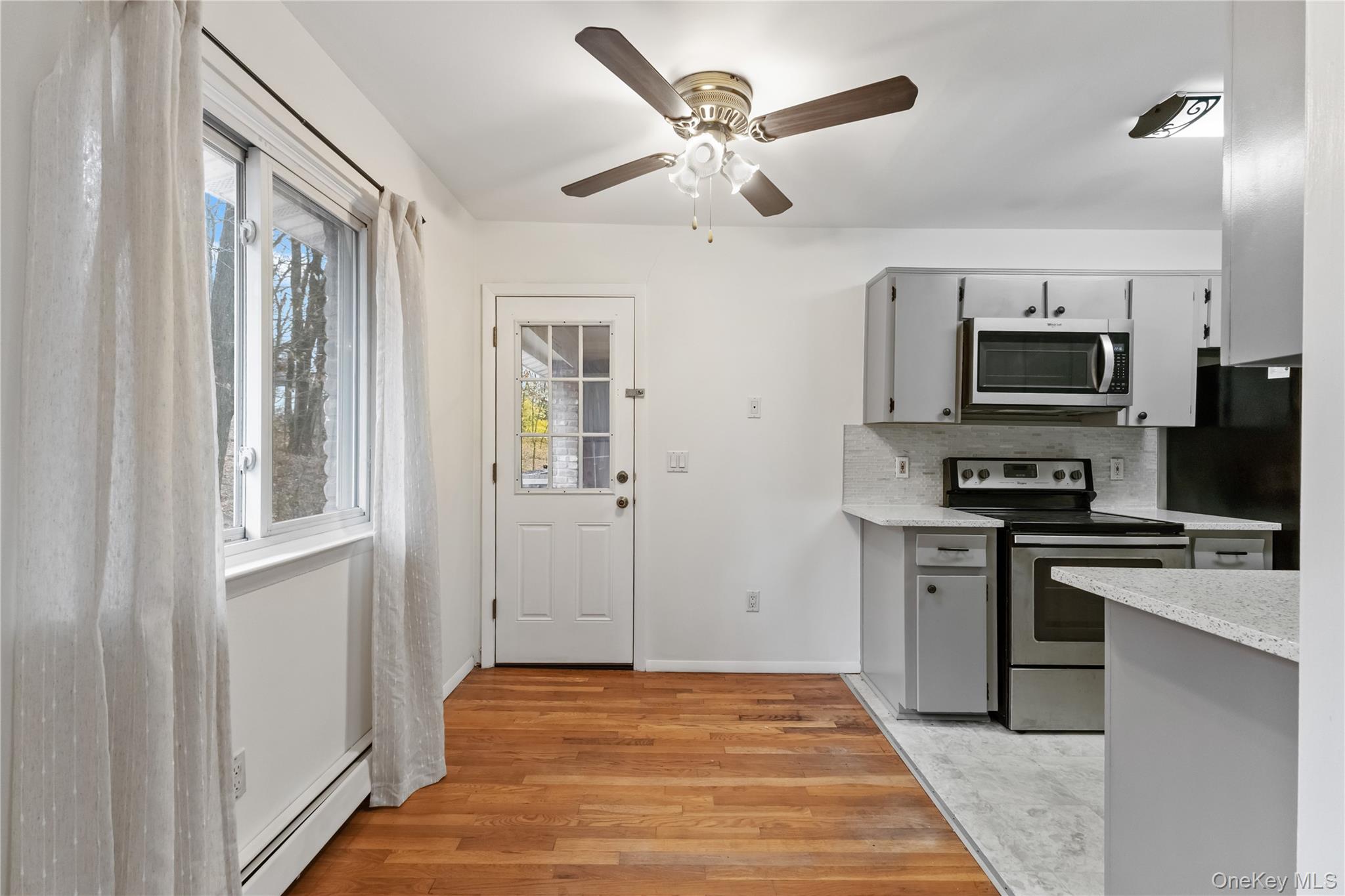 8 North James Street, Unit G Peekskill, NY 10566 - Photo 8 of 25 a view of kitchen with sink microwave and refrigerator