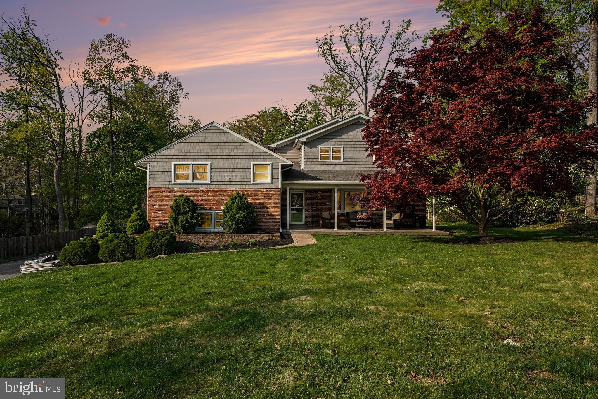 443 Woodcrest Road Wayne, PA 19087 - Photo 1 of 63 a front view of a house with a garden