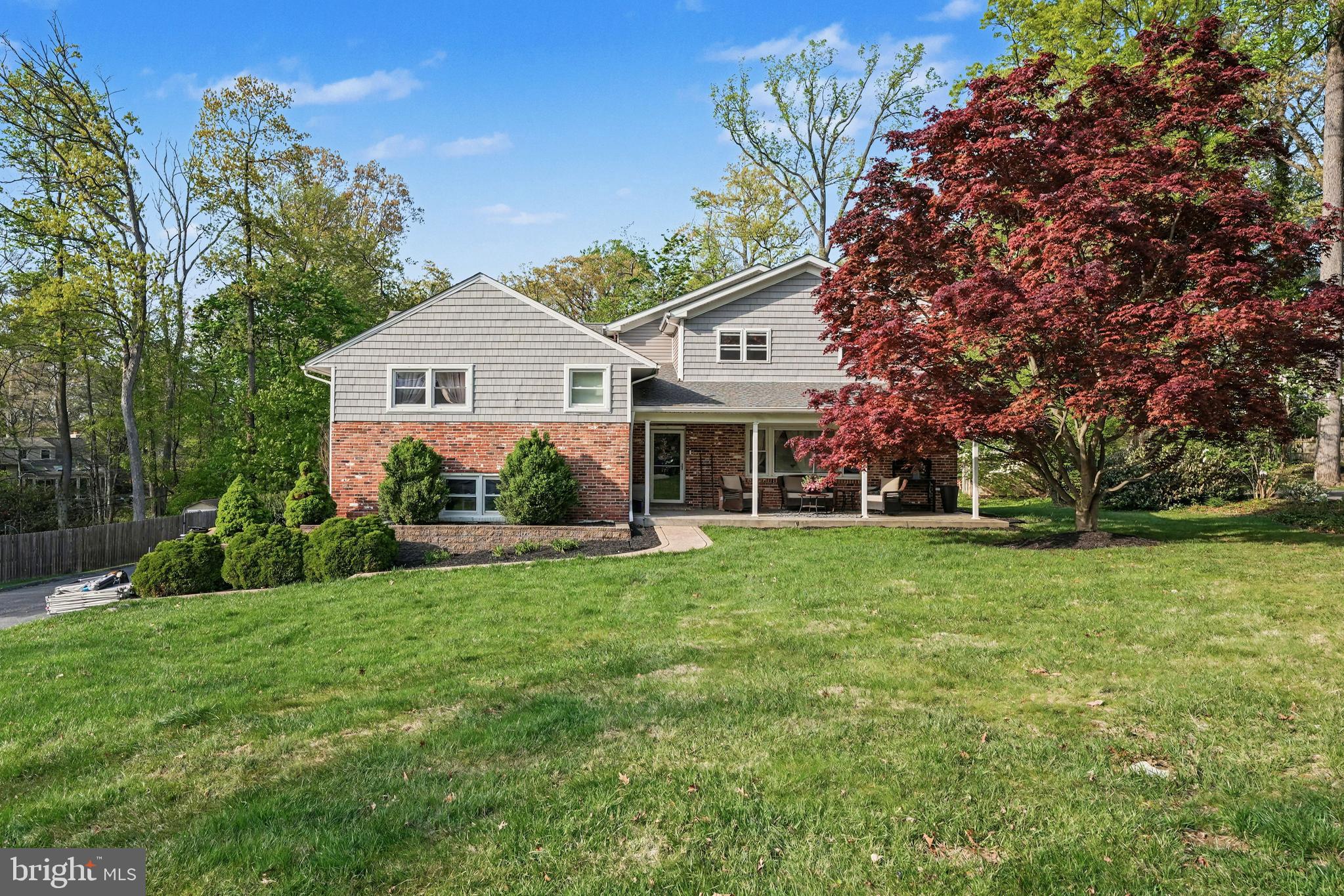 443 Woodcrest Road Wayne, PA 19087 - Photo 3 of 63 a front view of a house with a yard and trees