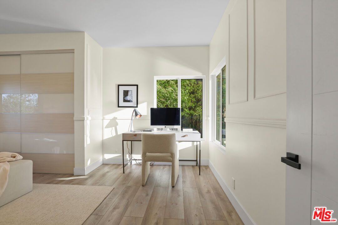 53 Saddlebow Road Bell Canyon, CA 91307 - Photo 51 of 66 a workspace with wooden floor and a bathroom