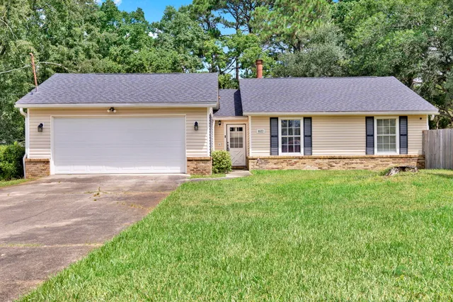 front view of a house with a yard