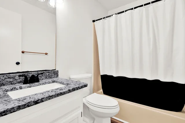 a bathroom with a sink and a toilet