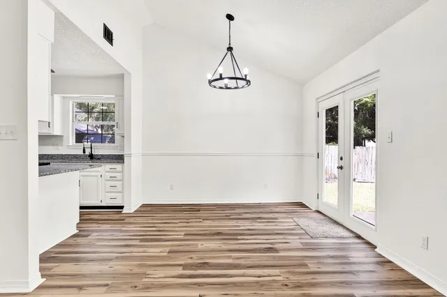 a view of a kitchen from the hallway