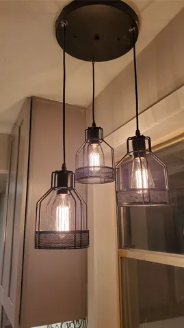 a view of kitchen with a sink and cabinets