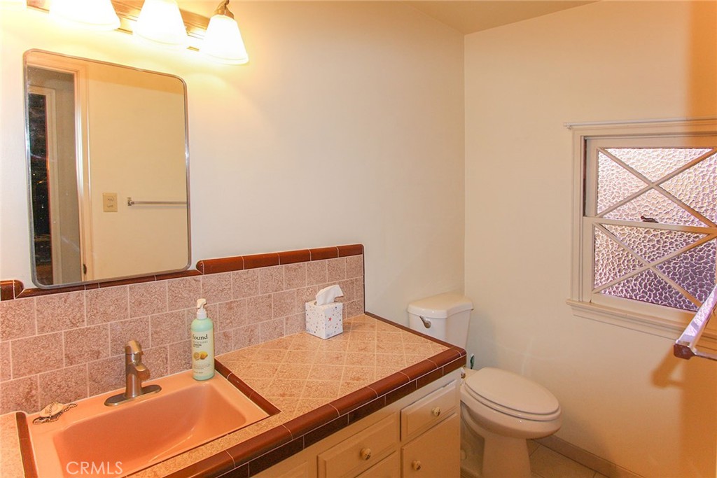 17832 Lemarsh Street Northridge, CA 91325 - Photo 14 of 14 a bathroom with a sink and a toilet