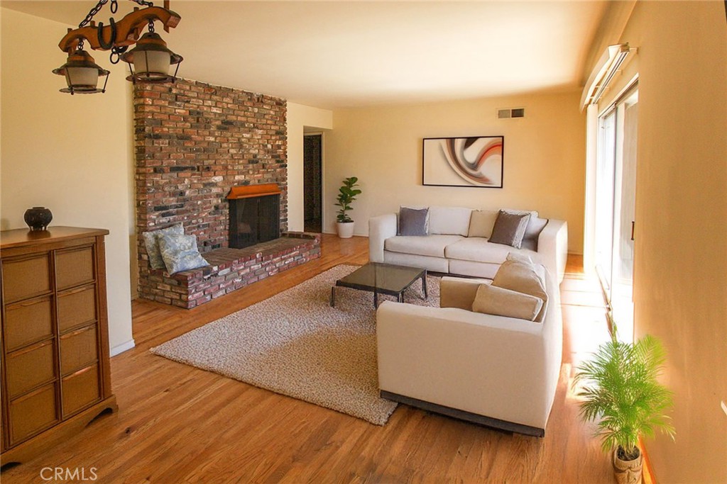 17832 Lemarsh Street Northridge, CA 91325 - Photo 2 of 14 a living room with furniture and a fireplace