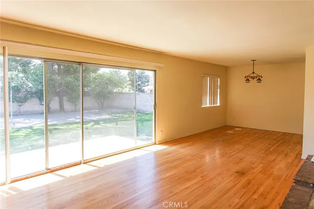 a view of an empty room and glass door