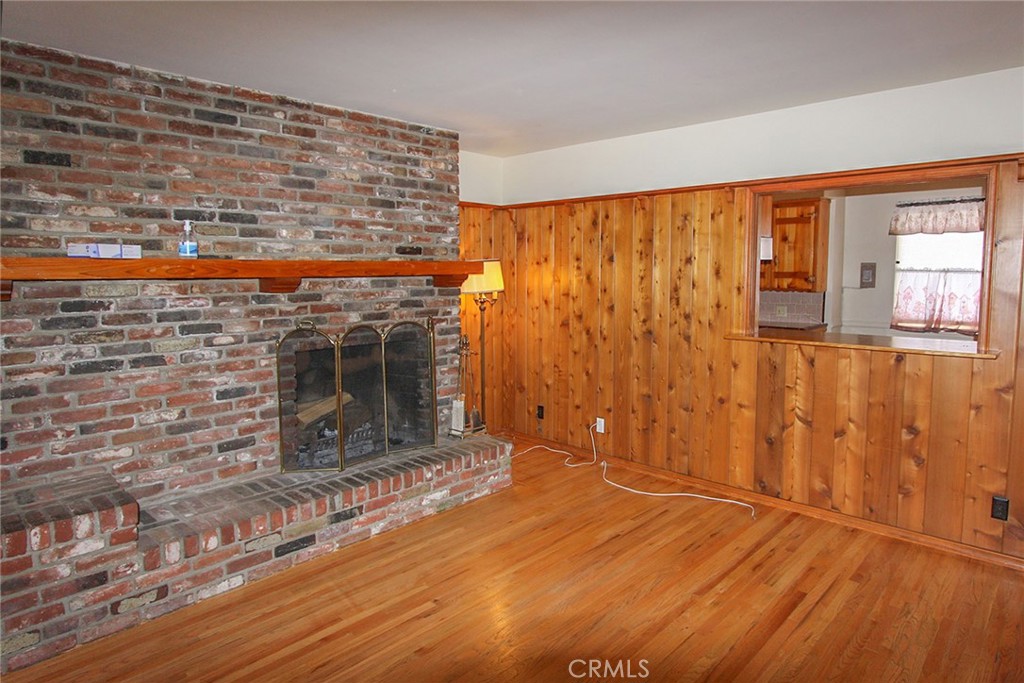 17832 Lemarsh Street Northridge, CA 91325 - Photo 9 of 14 a view of a livingroom with wooden floor and a fireplace