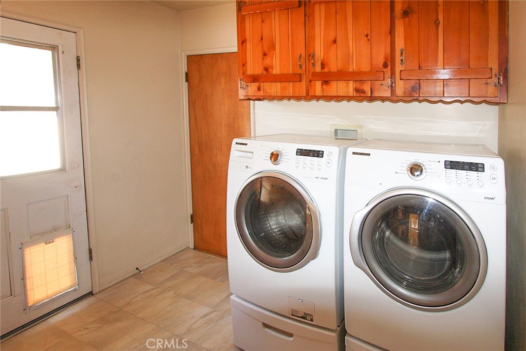 17832 Lemarsh Street Northridge, CA 91325 - Photo 10 of 14 a utility room with dryer and washer