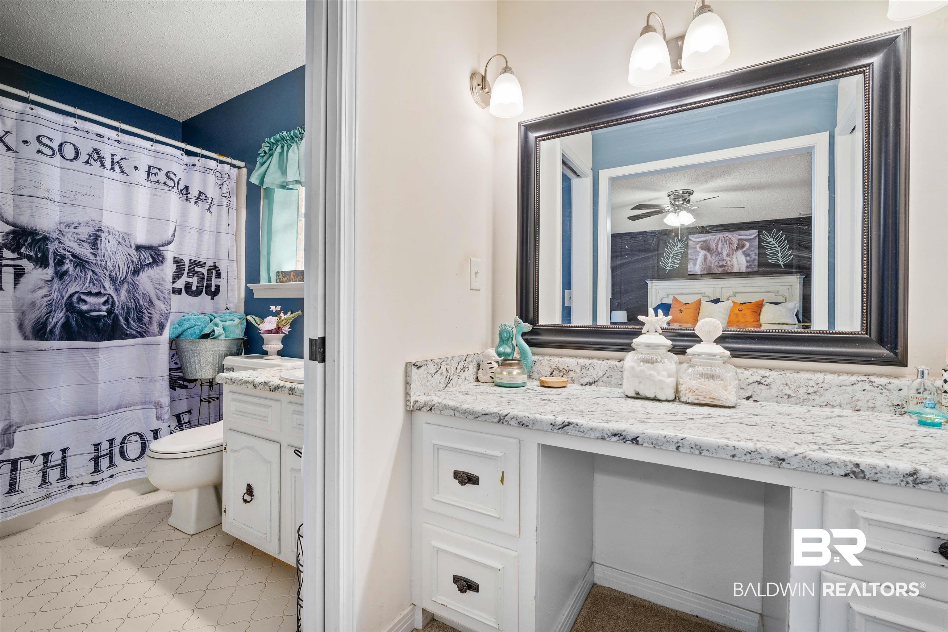 7807 Yorkhaven Road Mobile, AL 36695 - Photo 14 of 34 Bathroom featuring vanity, a shower with curtain, and light tile patterned floors