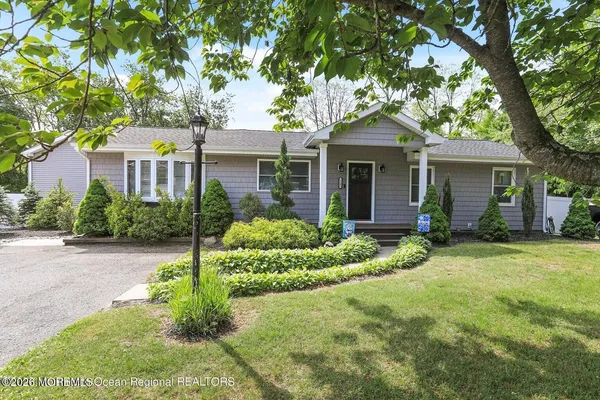 front view of a house with a yard