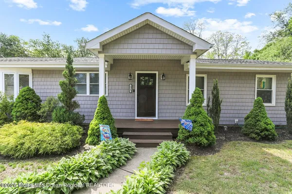 front view of a house with a yard