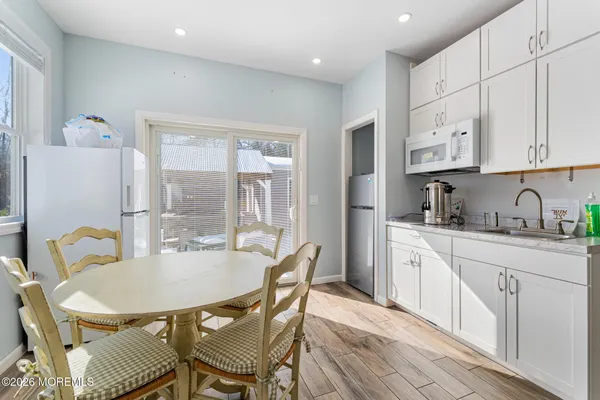 a spacious bathroom with a double vanity sink and a mirror