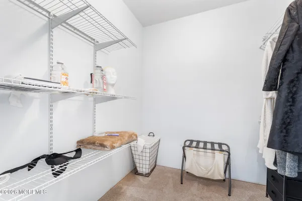 a bedroom with two beds and a window