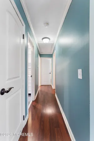 a bedroom with two beds and a chandelier