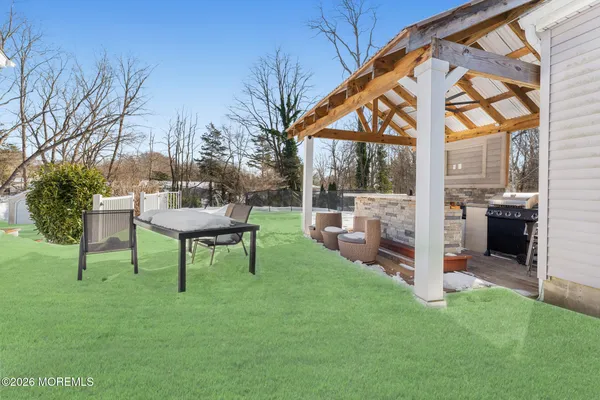 a view of a house with a yard patio and deck