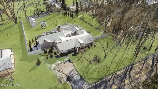 a view of backyard with swimming pool and outdoor seating