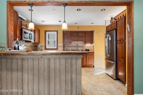 a kitchen with a sink stove and microwave