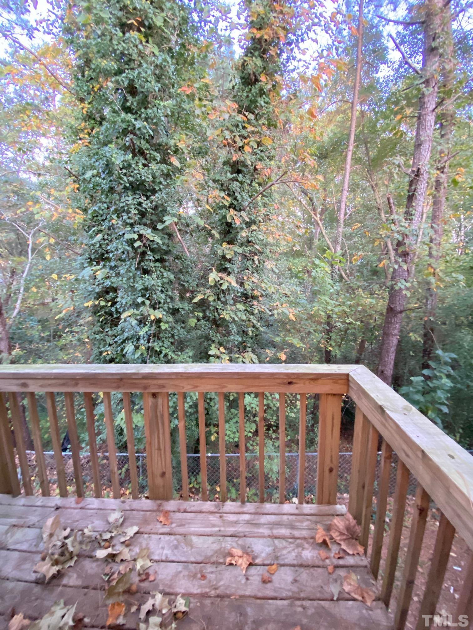4232 Kaplan Drive Raleigh, NC 27606 - Photo 12 of 21 a view of a wooden deck and a yard