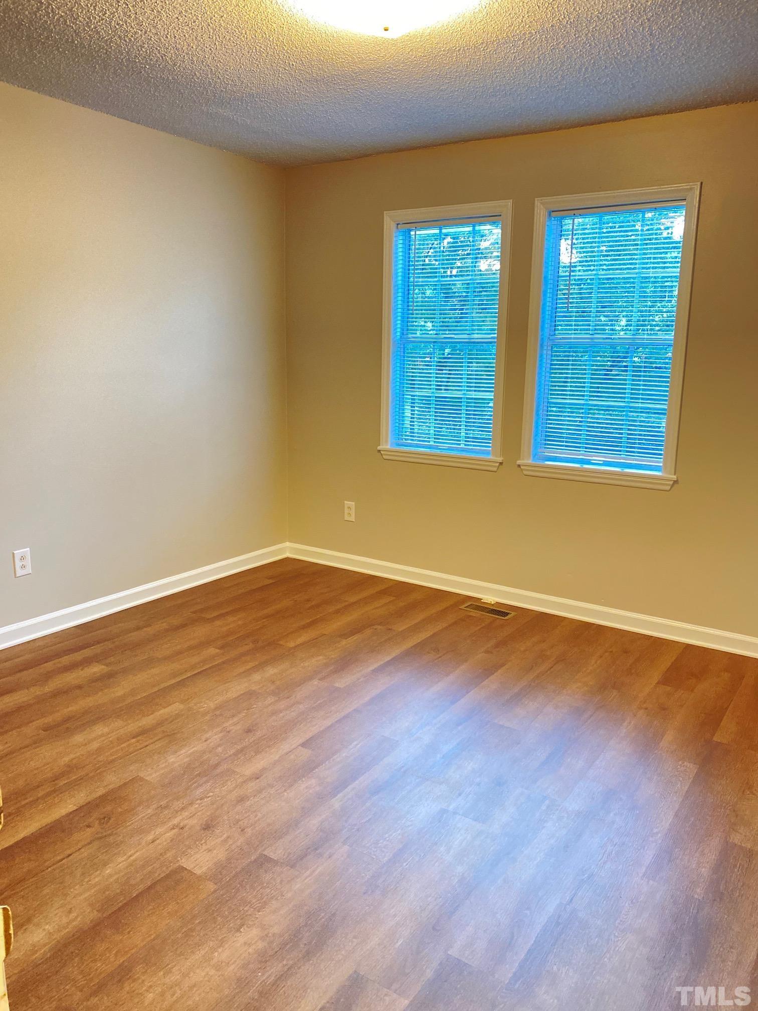 4232 Kaplan Drive Raleigh, NC 27606 - Photo 17 of 21 a view of a room with wooden floor and entryway