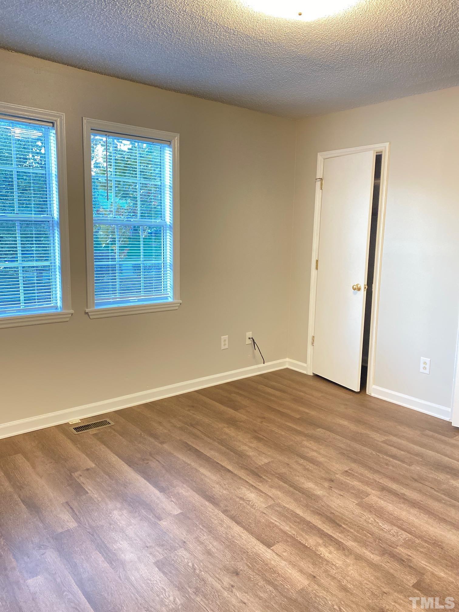 4232 Kaplan Drive Raleigh, NC 27606 - Photo 18 of 21 an empty room with windows