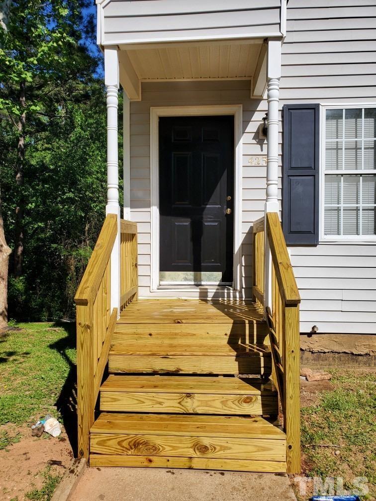 4232 Kaplan Drive Raleigh, NC 27606 - Photo 2 of 21 a view of house with entryway and stairs