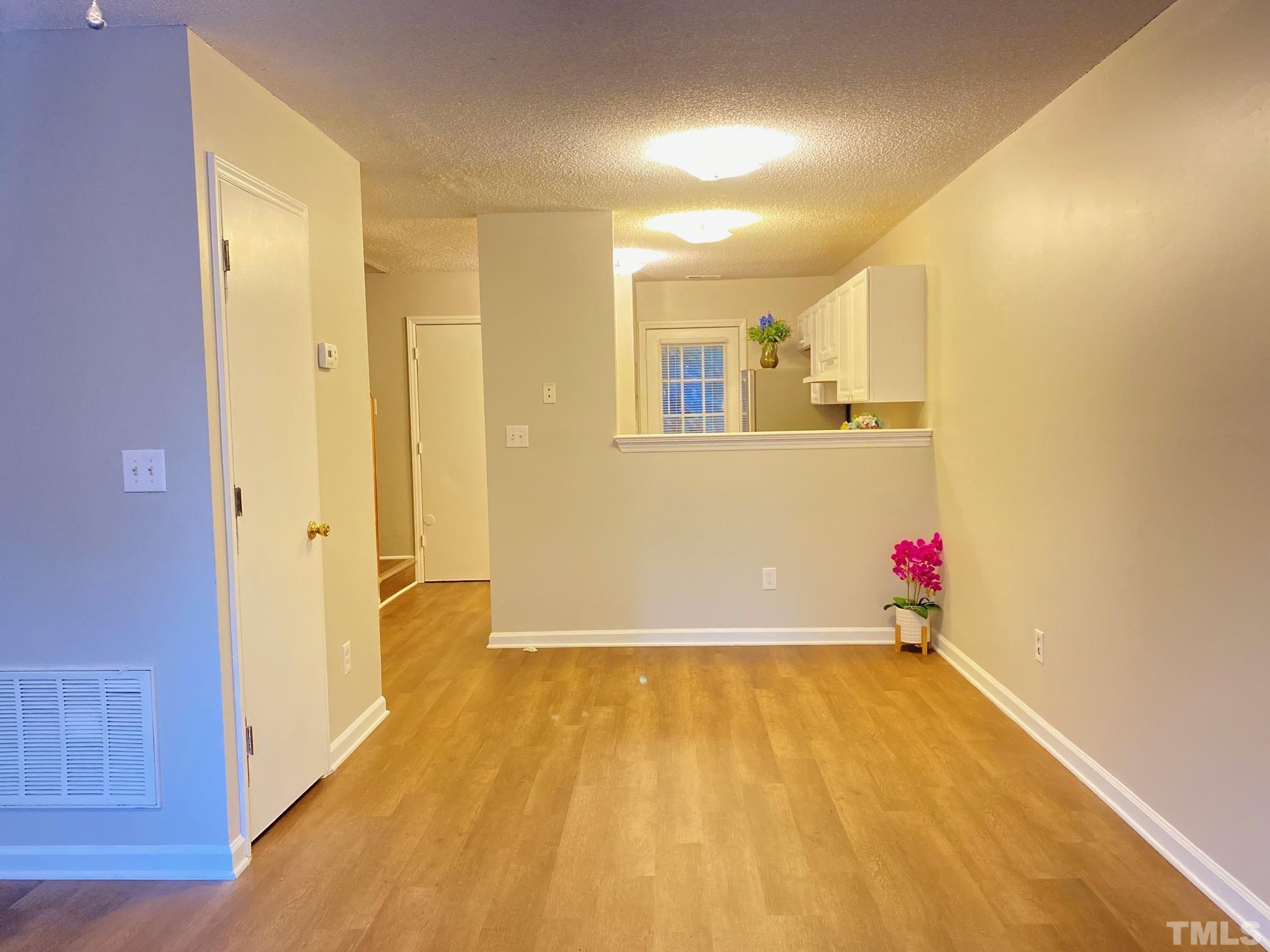 4232 Kaplan Drive Raleigh, NC 27606 - Photo 5 of 21 a view of a room with wooden floor and cabinet