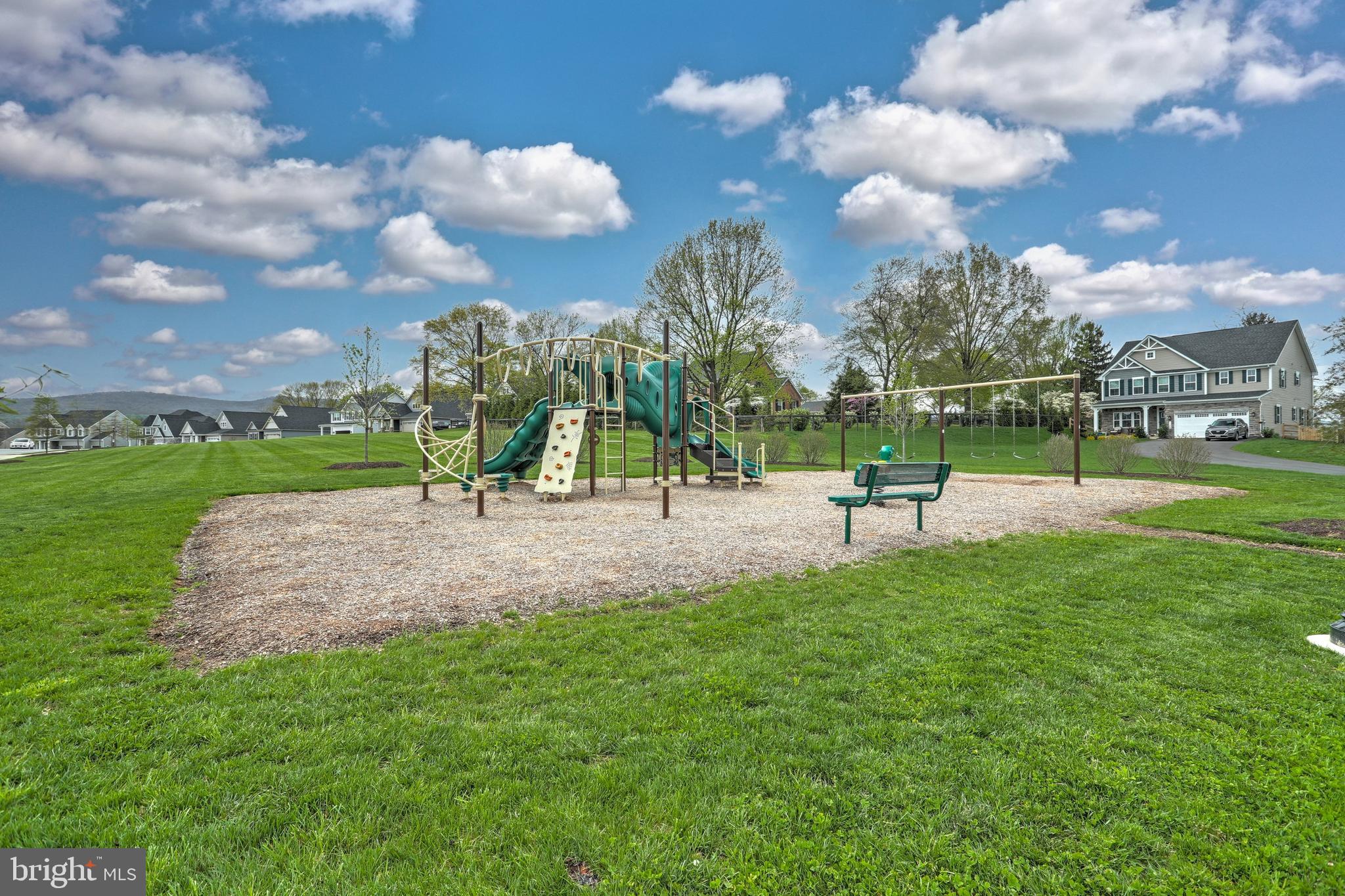 1807 Colt Lane Frederick, MD 21702 - Photo 2 of 40 a park with lots of swings and slides
