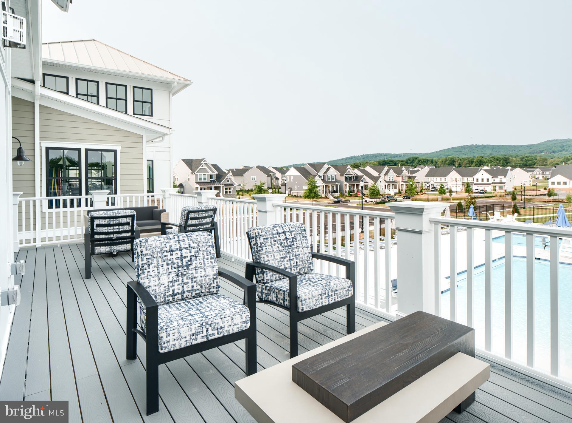 1807 Colt Lane Frederick, MD 21702 - Photo 25 of 40 a view of a balcony with wooden floor and outdoor seating