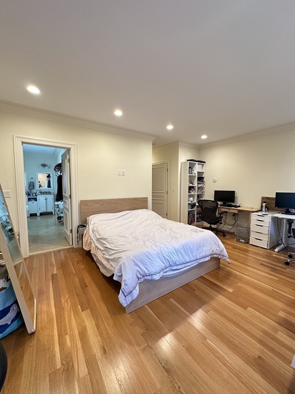 191 Newtonville Avenue, Unit 191 Newton, MA 02458 - Photo 13 of 41 a spacious bedroom with a bed and a view of living room