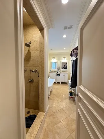 a view of a hallway with a view of living room