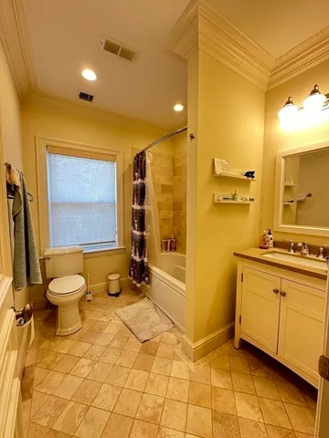 a bathroom with a sink mirror toilet and shower