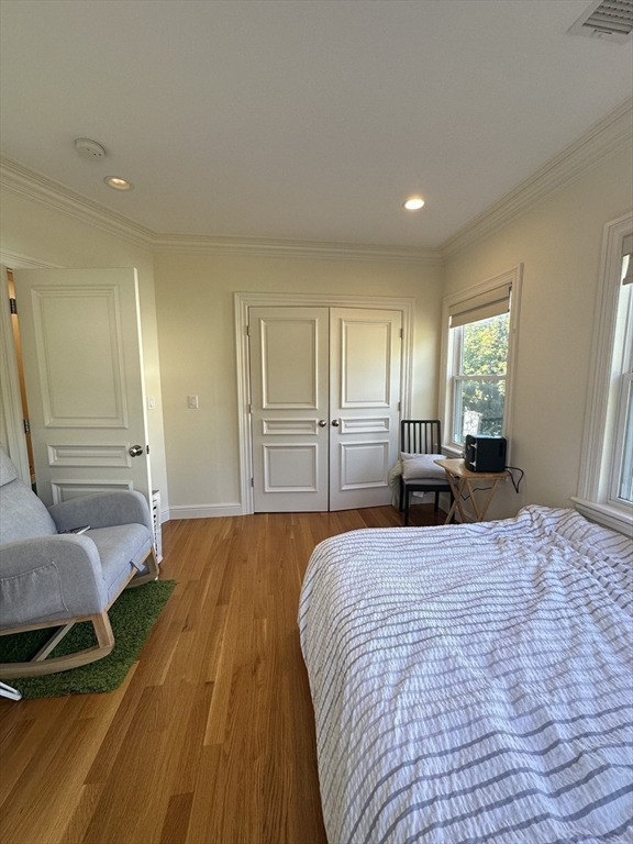 191 Newtonville Avenue, Unit 191 Newton, MA 02458 - Photo 23 of 41 a bedroom with a bed and dresser