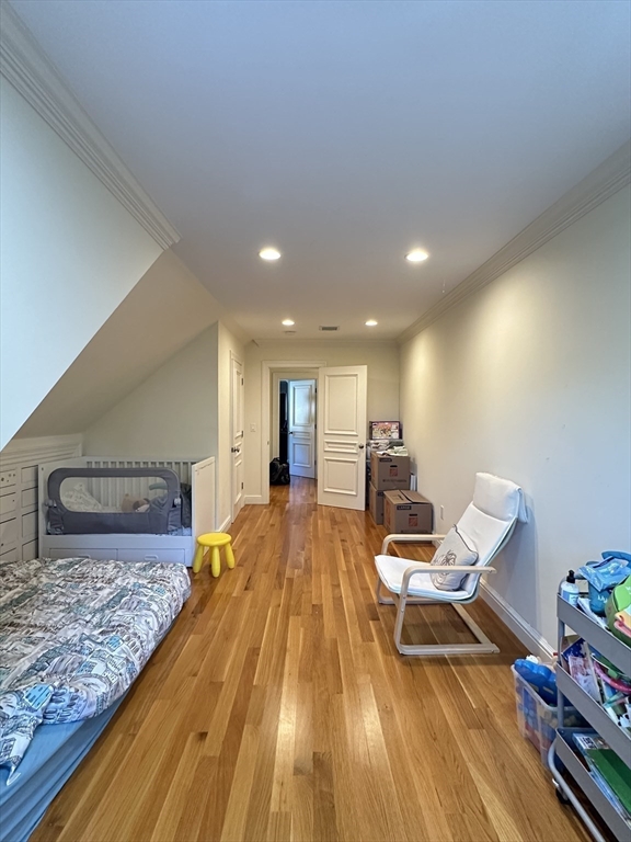 191 Newtonville Avenue, Unit 191 Newton, MA 02458 - Photo 27 of 41 a bed room with a bed and furniture