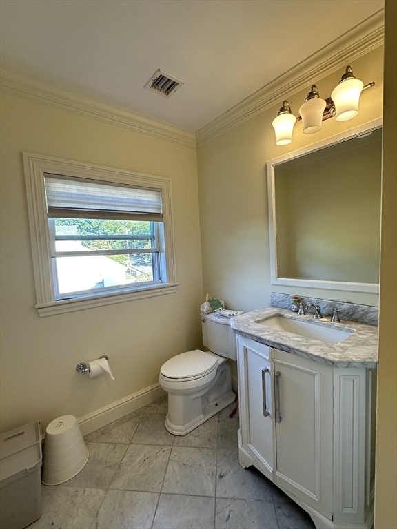 191 Newtonville Avenue, Unit 191 Newton, MA 02458 - Photo 29 of 41 a bathroom with a toilet sink and mirror