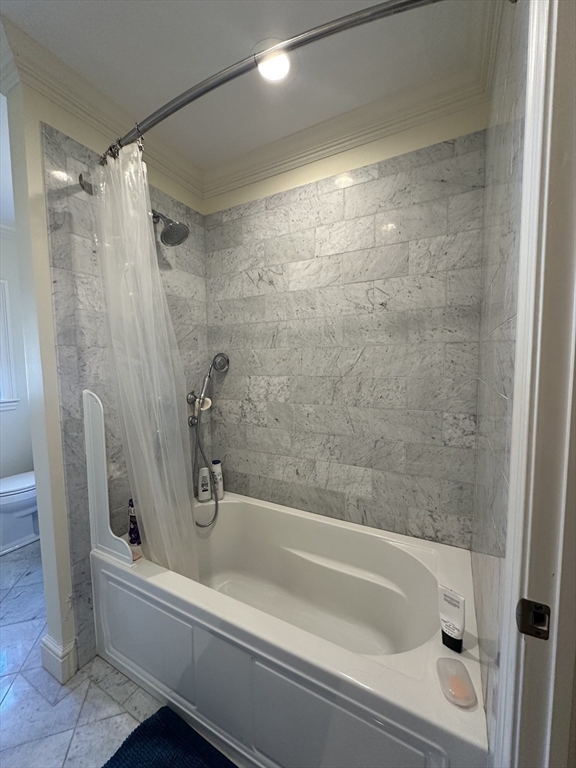 191 Newtonville Avenue, Unit 191 Newton, MA 02458 - Photo 30 of 41 a bathroom with a bathtub and a shower