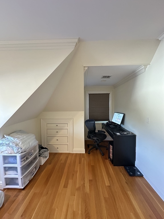 191 Newtonville Avenue, Unit 191 Newton, MA 02458 - Photo 33 of 41 a living room with a couch and dresser