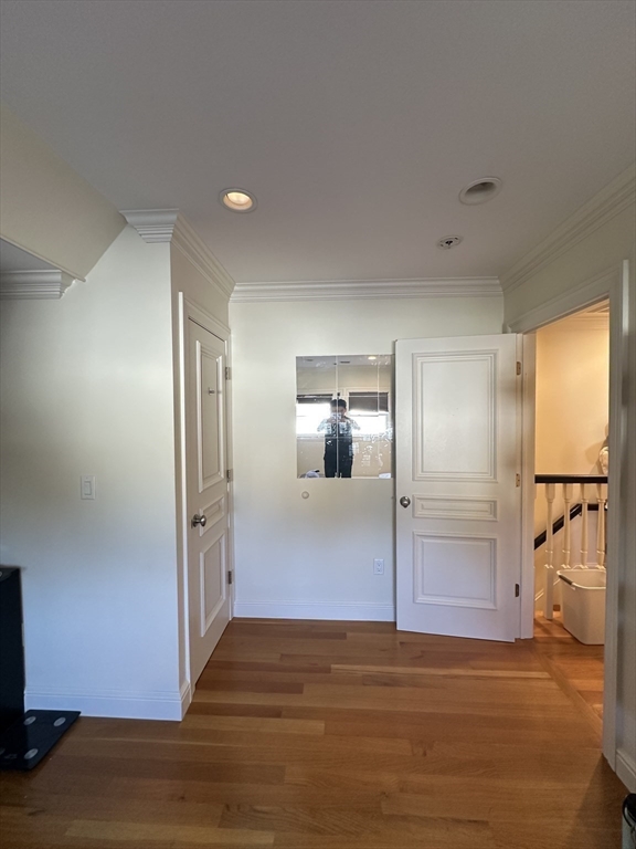 191 Newtonville Avenue, Unit 191 Newton, MA 02458 - Photo 34 of 41 a view of a hallway with wooden floor