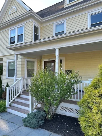 a view of a house with a yard and plants