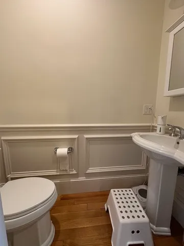 a bathroom with a sink toilet and vanity