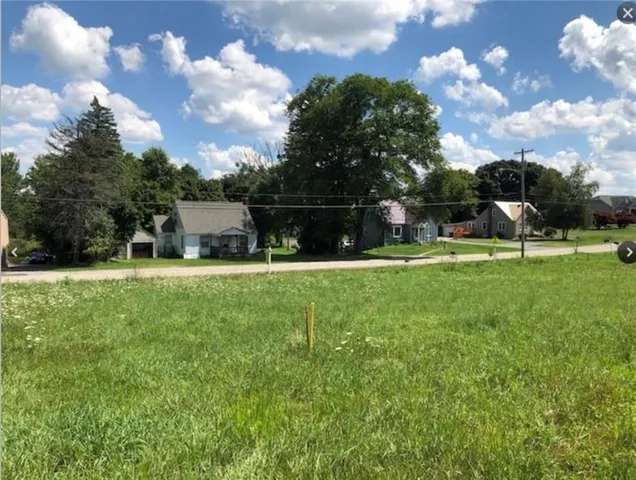 a view of house with backyard