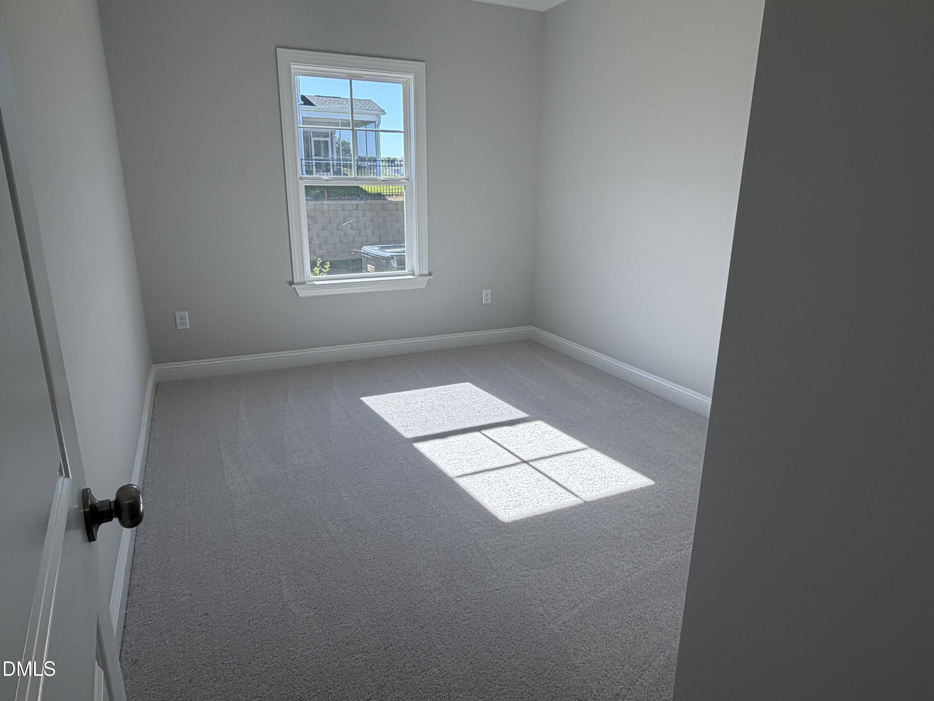3016 Sandy Bluff Road Raleigh, NC 27616 - Photo 14 of 34 an empty room with windows