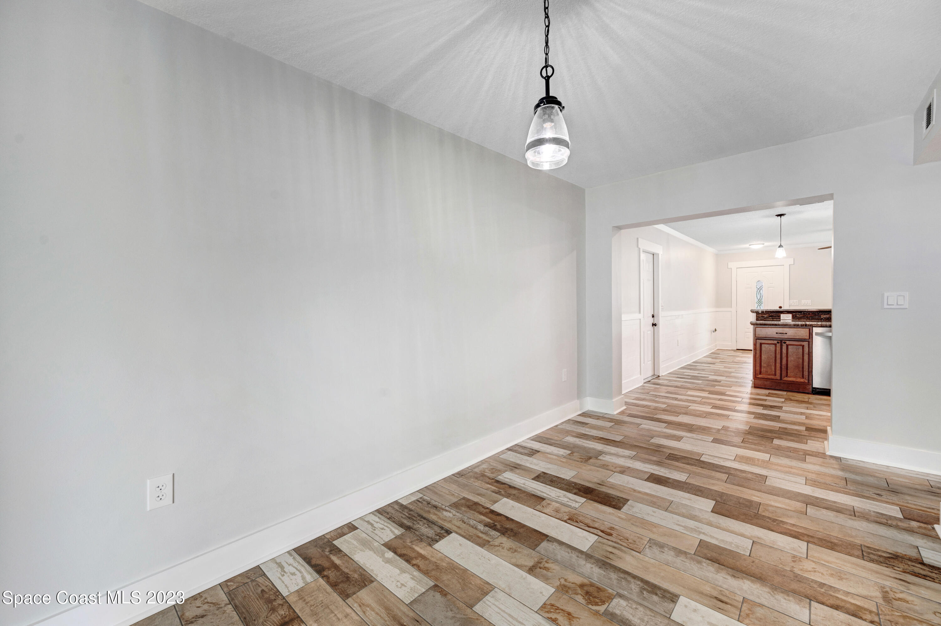1720 Elizabeth Street Melbourne, FL 32901 - Photo 11 of 33 a view of empty room with wooden floor