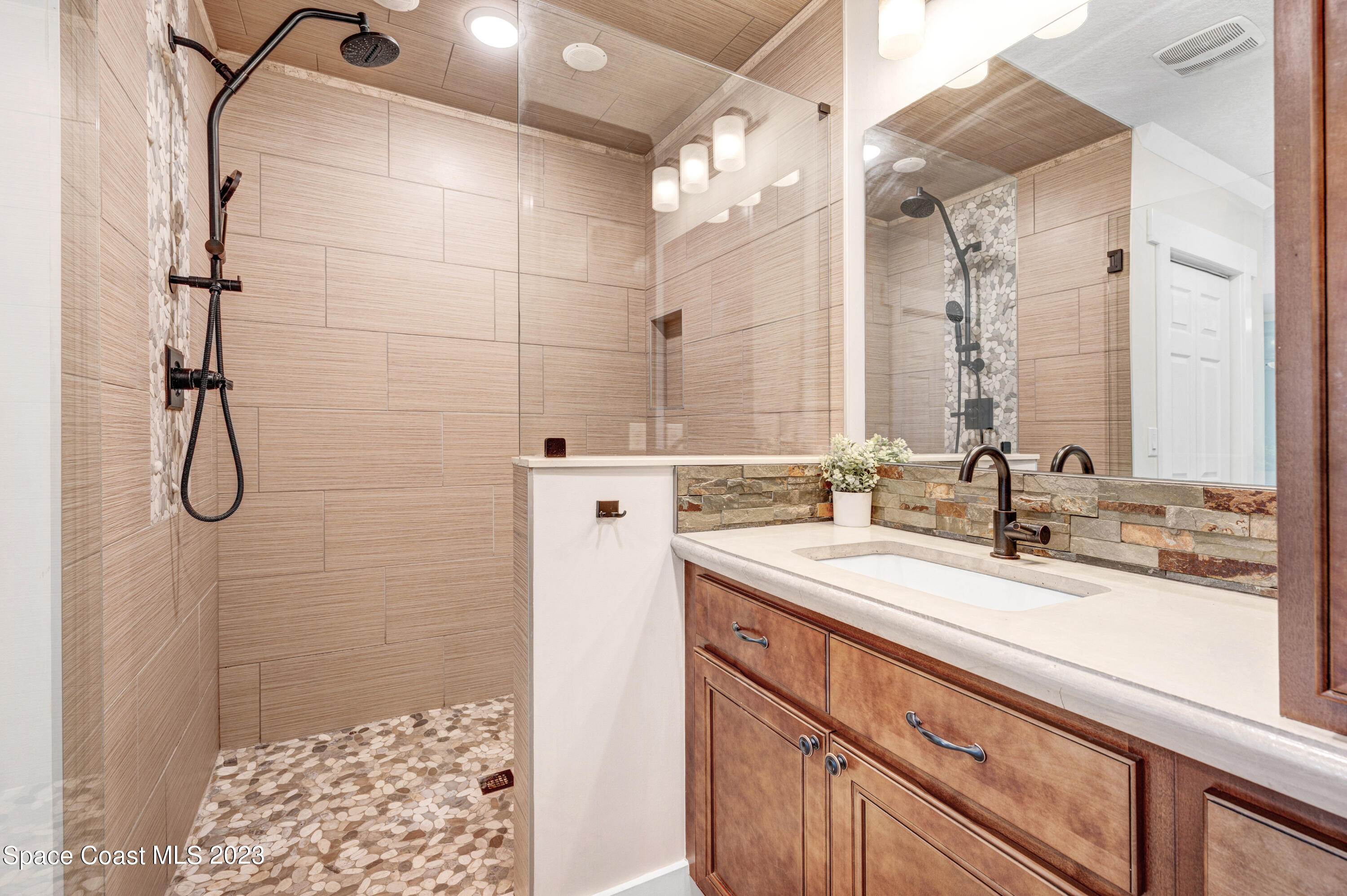 1720 Elizabeth Street Melbourne, FL 32901 - Photo 12 of 33 a bathroom with a sink and a mirror