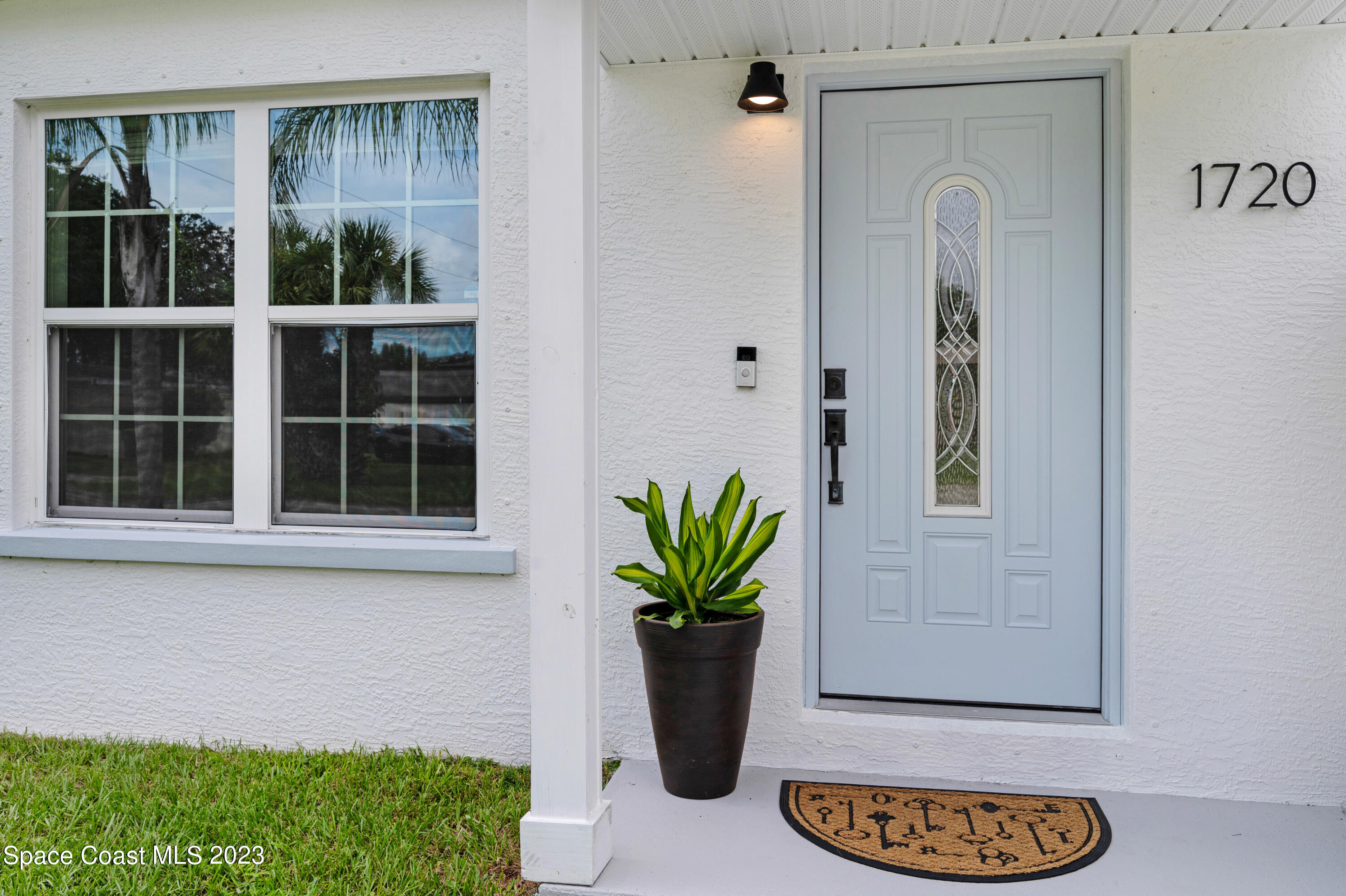 1720 Elizabeth Street Melbourne, FL 32901 - Photo 2 of 33 a view of front door with potted plant