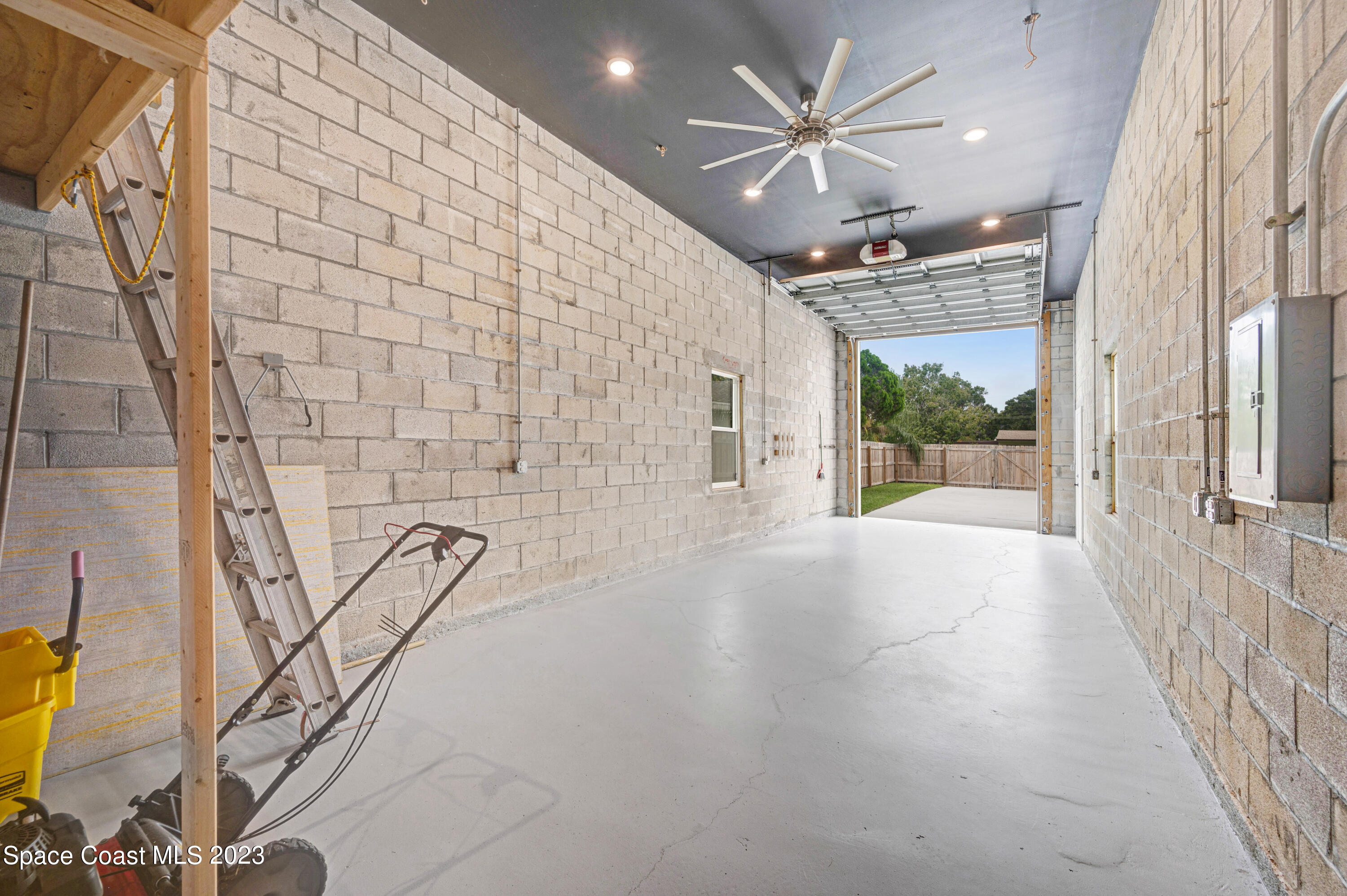 1720 Elizabeth Street Melbourne, FL 32901 - Photo 24 of 33 a view of a livingroom with a ceiling fan and window